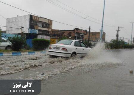 بارش باران های پاییزی در شهرستان لالی/از آبگرفتگی خیابان ها تا ریزش کوه ها + عکس